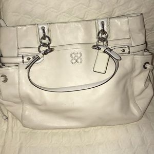 Cream colored Coach purse